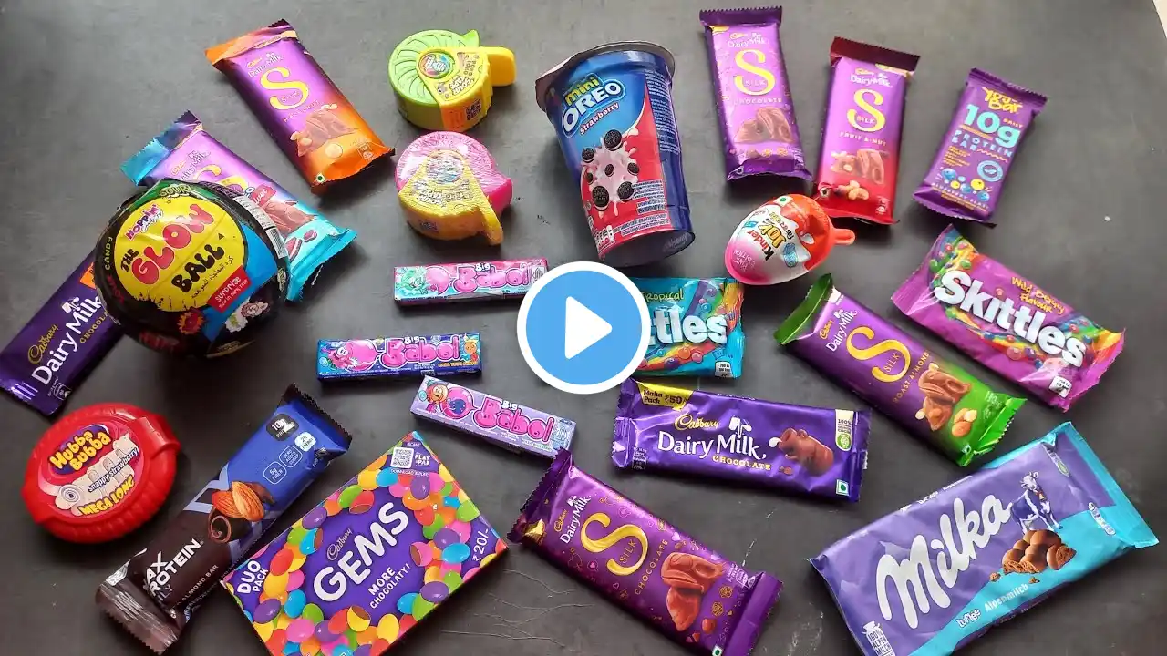 100 candies opening, chocolate a video, lots of chocolates, Cadbury celebration, surprise toys